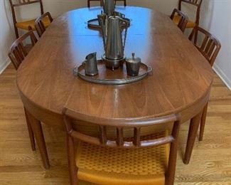 MCM Teak J.L. MOLLER Models 8 Chair Set with Original Woven Seats and MOGENS KOLD Teak Dining Room Table with Two Leaves