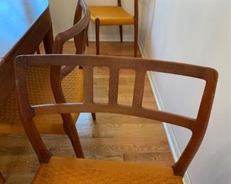 MCM Teak J.L. MOLLER Models 8 Chair Set with Original Woven Seats and MOGENS KOLD Teak Dining Room Table with Two Leaves