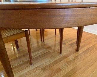 MCM Teak J.L. MOLLER Models 8 Chair Set with Original Woven Seats and MOGENS KOLD Teak Dining Room Table with Two Leaves