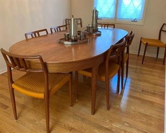 MCM Teak J.L. MOLLER Models 8 Chair Set with Original Woven Seats and MOGENS KOLD Teak Dining Room Table with Two Leaves