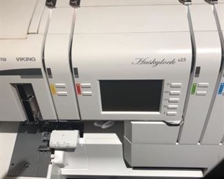 Serger with attachments and instructions and carrying case 