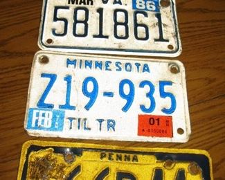 Some fiber board and metal license plates