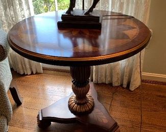 Round brown wood inlaid side pedestal table in great condition.  Dimensions 27" diameter x 26.5" h.  Price $195