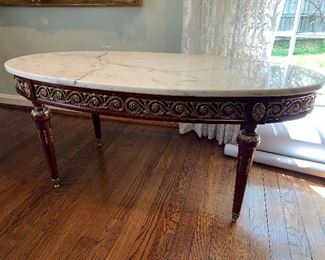 White marble top on carved wood base coffee table in great condition.  Dimensions 3'8" long x 20.5" wide x 18.5" h.  Price $375
