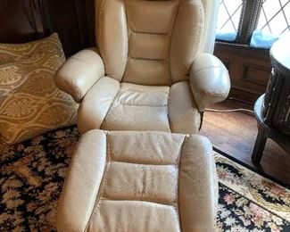 Beige leather recliner chair in good condition.