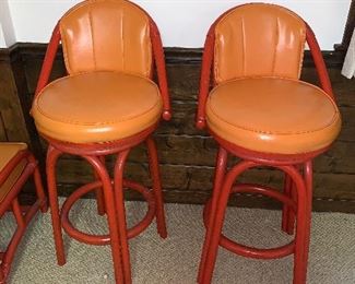 Pair of vintage rattan orange barstools in great condition.  Dimensions 18"dx 38"h (top of back). Price for pair $250