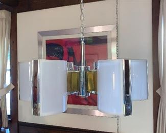 Mid century glass and chrome light fixture in great condition.  Dimensions 27"w x 8"cone hangs from ceiling chain.  Price $250