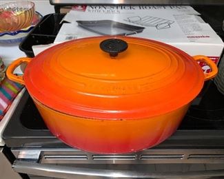 Le Crueset #31Orange/red color Dutch oven (6.75" quart) in great condition.  Price $150