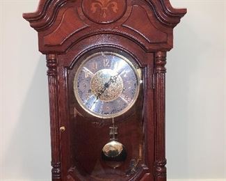 Howard Miller wall clock model #613302 - $250  Dimensions 27"x13.5"x6"