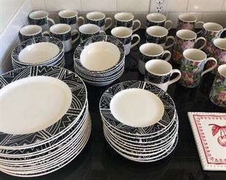 Oneida “Contours” black & white dishes (service for 12 = 48 pieces), ceramic cherry tile trivet NOW $3 (Floral mugs are SOLD)