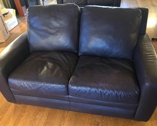 NOW: $300 each. One of a pair of "eggplant” color leather 5 ft. loveseats by American Leather. They're very dark purple. Each 59”L, 36”D, 32”H. NO tears.