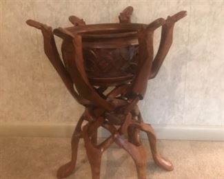 Wood carved planter on stand.