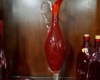 'Tall red decanter with stopper 