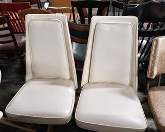 2 Cream vinyl padded swivel chairs with gold ornate bases 
