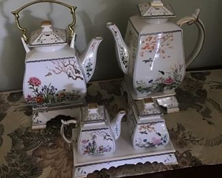 Birds & Flowers  of the Orient Coffee & Tea set. Sugar & Creamer also.  Each of the pieces have their own stand. Matching Clock included  8 pieces 
$150