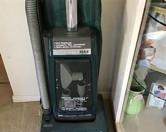 Hoover Hi Performance Self Propelled Vacuum with Attachments inside front Cover