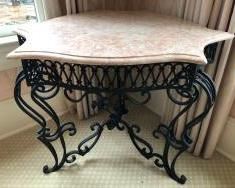 Uniquely Shaped Wrought Iron Marble Top Table with Wrought Iron Bouquet of Roses Centerpiece Set in Base.