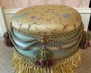 Satin Upholstered Padded Foot Stool with Dragon Flies on Top and Brass Bee Forms on the Sides with Tassels and Roping