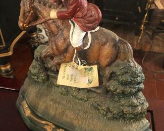 Equestrian with horse stuck in mud