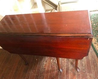 drop leaf table looks like a its wearing a shroud