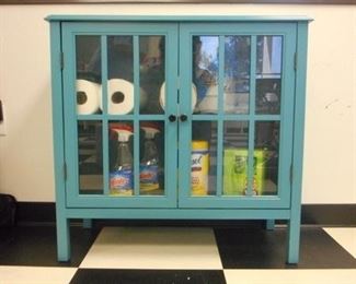 Lot 106 Blue Wooden Cabinet with Glass Pane Doors Cleaning Products