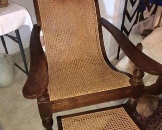 Caned lounge with foot rest