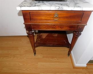 Marble top side table with original casters