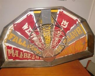 Antique basketball hoop and pennants framed