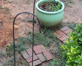 Shepard Hooks and assorted clay pots and yard art