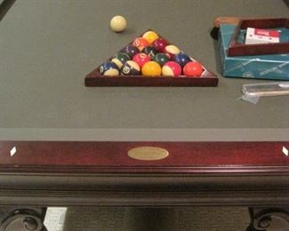 Olhausen 8 foot pool table with accessories, cover  and sticks.