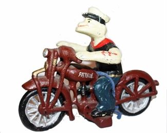 POP POPEYE ON MAROON MOTORCYCLE
