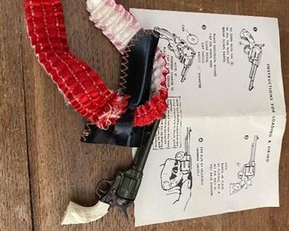 Vintage miniature revolver on garter