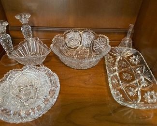 Many pieces of cut and pressed glass