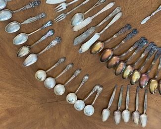 Various pieces of silver plate flatware