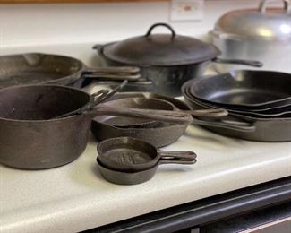 Many pieces of cast iron cookware