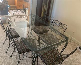 Glass top dining table with 6 chairs.