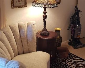 white brocade chair, side table, lamp