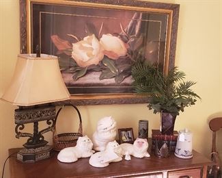 Oak desk, lamp, framed magnolia print, ceramic cats, greenery