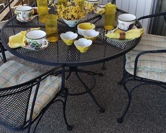 Wrought iron patio set, colorful table ware