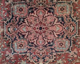 Close-up of the center medallion of the antique Persian Heriz rug.