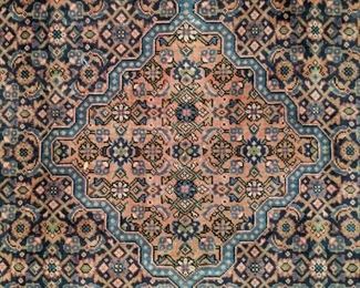 Close-up of the center medallion on the Persian Bijar rug.
