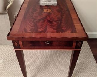 One of a pair of vintage flame mahogany Hekman side table,  with double candle pulls. 