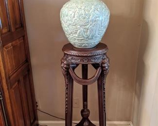 Lovely, vintage carved mahogany 3-legged stand, with carved feet, stretcher with carved urn, large celadon Asian porcelain urn. 