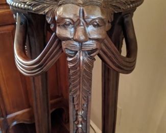 Detail of the carving on the mahogany pedestal.