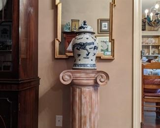 Up close and personal view of the wooden pedestal, vintage Asian porcelain ginger jar and LeBarge wall mirror. 