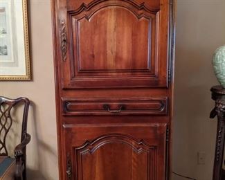 Vintage French walnut bonnetiere, measures 35" wide x 21 1/2" deep x 6' 3" tall.