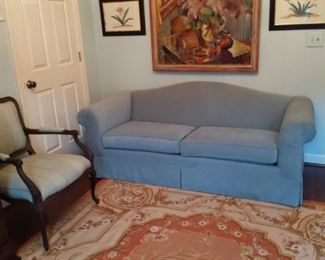 Baker upholstered couch, with French Aubusson rug, French bergere chair, pair of nicely framed/matted botanicals and an original oil on canvas, by NY artist, Sally Lustig.