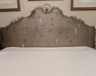 Close-up of the hand-painted silk/Carved wood French headboard.