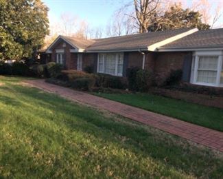 Long ranch resting on a beautiful lot, a fabulous brick patio area with detached two car garage. 