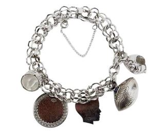 83. Sterling Silver Bracelet with Trinkets. Stamped